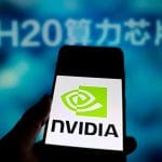 Nvidia logo on smartphone, H20 chip in the background. AI chip crisis in China.