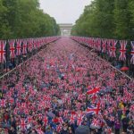 Crowd with British flags in London. Political demonstration near the Arc de Triomphe.
