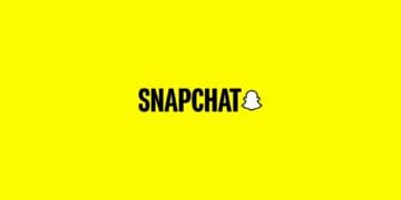 Snapchat logo on yellow background. Popular social media application.