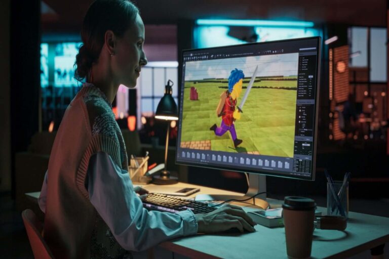 Video game developer creating a 3D character on screen, illustrating generative AI and its impact on creators.