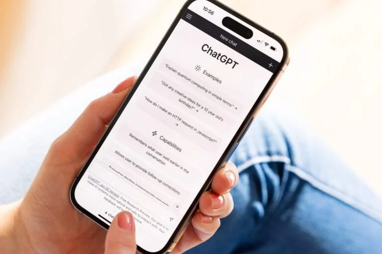 Hand using a smartphone displaying the ChatGPT interface. AI could interact with your health and medical data.