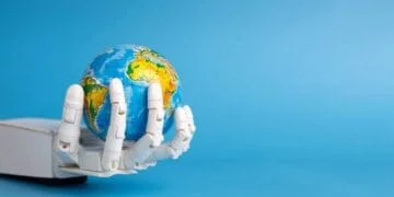 Main robotique blanche tenant un globe terrestre miniature sur fond bleu. Représente l'IA et les World Models simulant le monde.