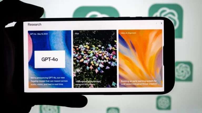 Smartphone displaying the OpenAI search page with GPT-4o, Sora and Safety. Screen displaying ChatGPT-4o innovations.